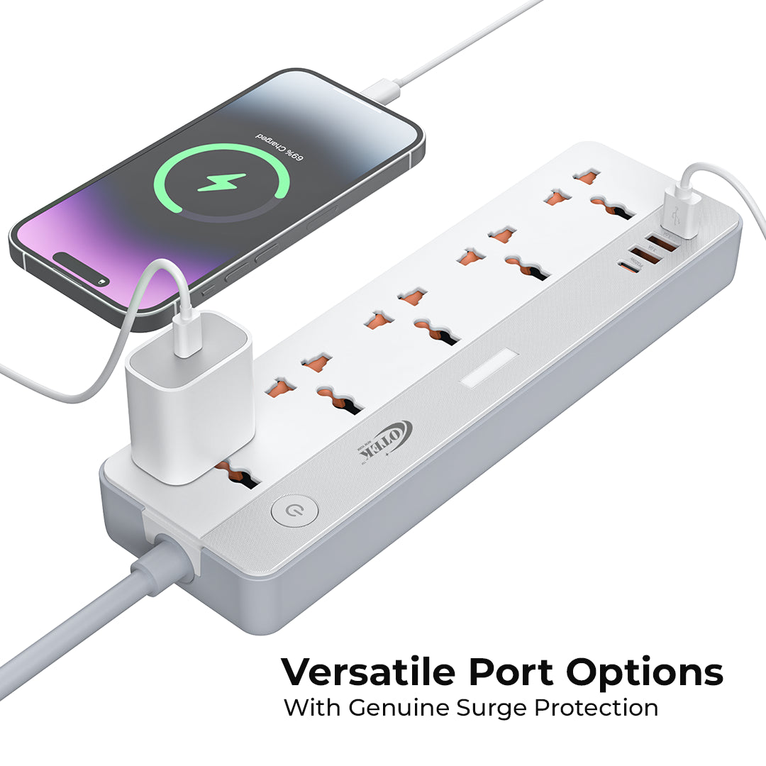 The VoltSafe 531 extension board by Otek World, in use, powering a laptop, desk lamp, and phone charger, showcasing its utility for a modern workspace